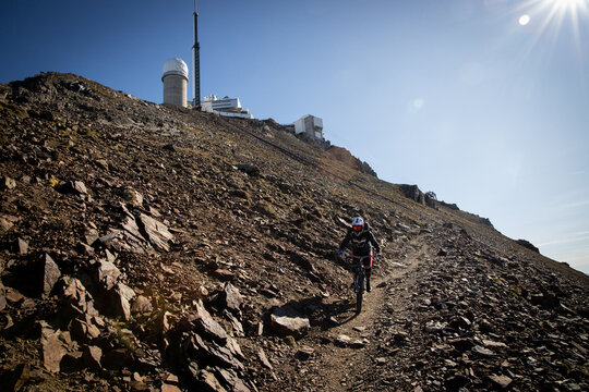 Mountain trail runs back towards the observatory on a summit of the Pyrenees, Bagneres-de-Bigorre, France