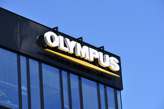 Olympus signage, logo on the facade of Olympus Polska office, Japanese manufacturer of optics and photo technics. WARSAW, POLAND - JUNE 3, 2023