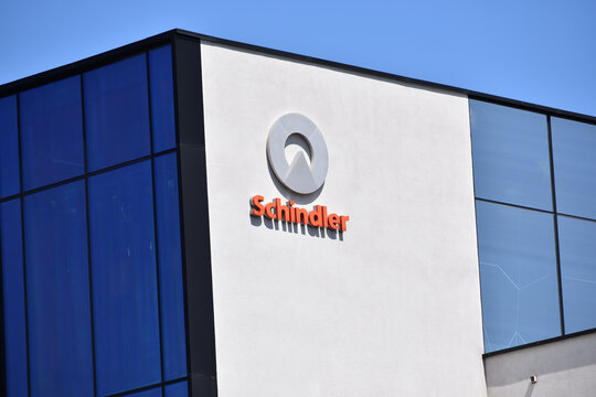 Schindler Group signage, emblem, logo, sign on the facade. Elevator manufacturer company. WARSAW, POLAND - JUNE 3, 2023