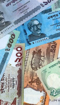Bangladeshi taka money bills in pile. Big amount of Bangladesh BDT currency cash close up