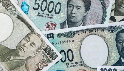 Japanese yen money bills in pile on table. Japan JPY currency cash close up © Viktor