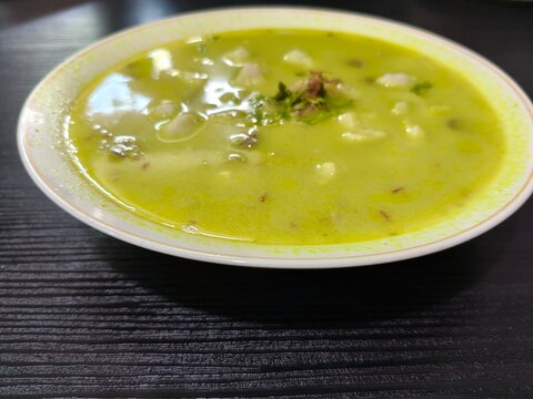 Batagor of Green Soup on Dark Table