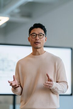 Business presenter in a modern office delivering training and a corporate talk for presentation background and website banner use