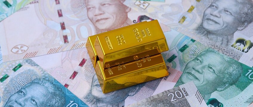 South African rand money bills and gold bullion bars. South Africa cash bills of ZAR currency