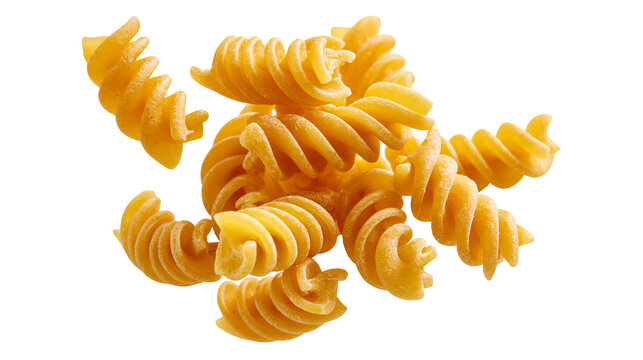 Dry uncooked golden yellow fusilli pasta spirals