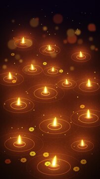 Floating diya oil lamps on dark water vertical motion background
