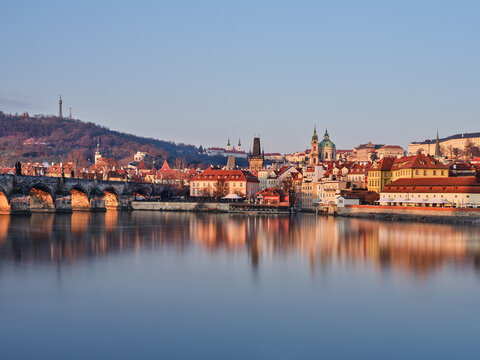 Charles Bridge and Petrin Hill above Mala Strana at sunrise