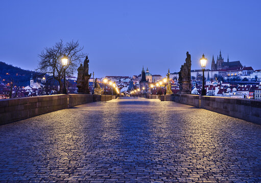 Lamplit Charles Bridge leading to Mala Strana and Prague Castle