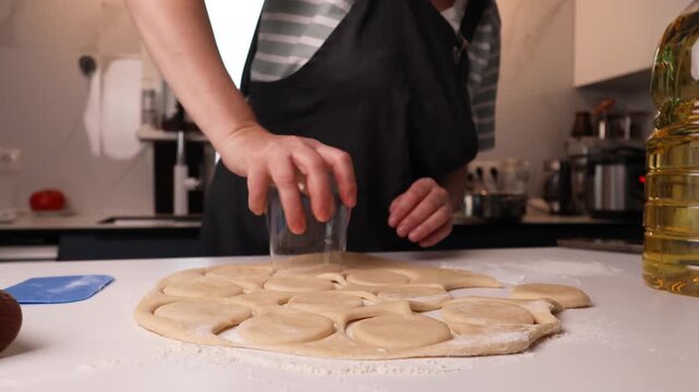 Pizza dough rounds shaped on a bright home kitchen countertop ready for baking