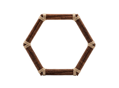Hexagonal frame made of aromatic cinnamon sticks tied together with rustic natural jute twine