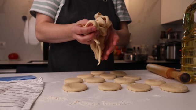 Dough shaping in a warm home kitchen emphasizing texture and authenticity