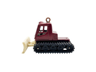 Side view of a miniature maroon bulldozer toy with a white blade isolated on a transparent background © ieps