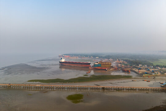 Panoramic Drone View of Large Bulk Carrier Dismantling Yard along Sitakunda Coastline. The Chittagong Ship Breaking Yard is a major global ship recycling center located along coastal strip