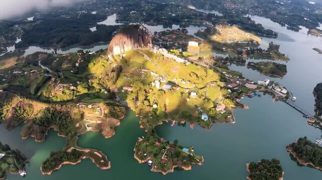 Guatap&eacute; and El Pe&ntilde;&oacute;n de Guatap&eacute; Surrounded by Reservoir Islands in Antioquia, Colombia. Time Lapse. Establishing Shot. Aerial View.