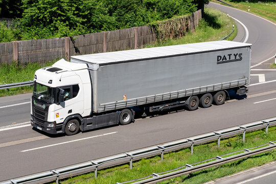 Wiehl, Germany - May 26, 2026: Scania R-Series truck with DATYS curtainside trailer on motorway