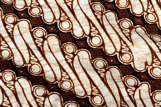 Traditional Indonesian batik parang fabric with diagonal blade motif in sogan brown and cream