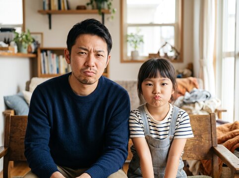 不満そうな親子