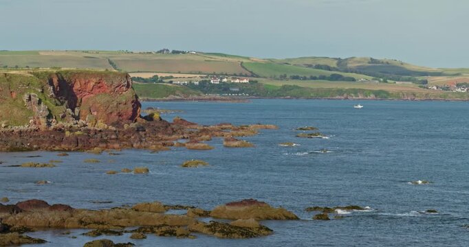 Rugged Coastal Cliffs and Rocky Shoreline with sandy beach in Eyemouth 4