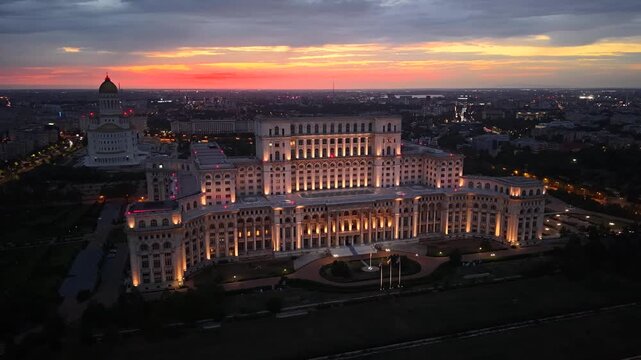 Dusk aerial shot of Palace of the Parliament in Bucharest city, Romania