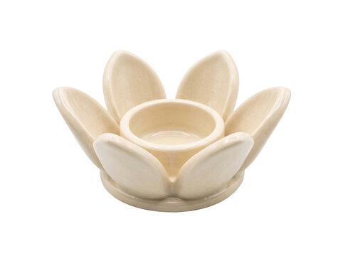 Elegant cream ceramic lotus flower candle holder isolated on a clean transparent background studio shot