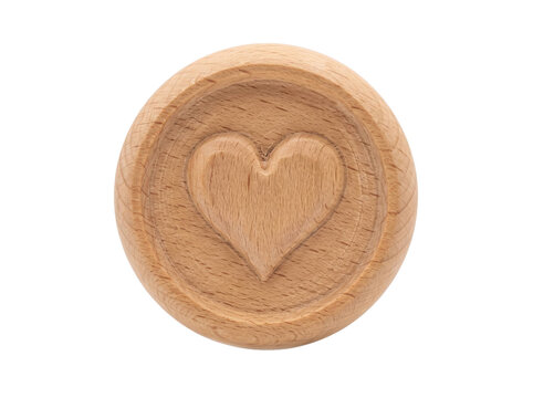Round wooden token featuring a carved heart symbol isolated on a clean transparent background surface
