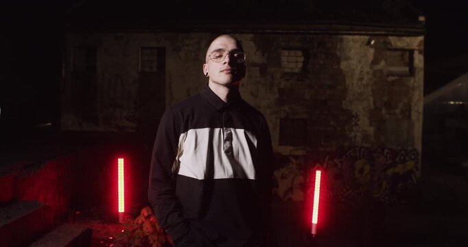 A young man in the abandoned building at night