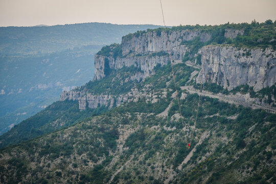 Raking light picking out every ledge of the limestone wall of the Cirque de Navacelles, France