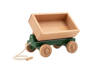 Classic wooden pull wagon toy with a natural finish and green painted base on transparent background © Frodo
