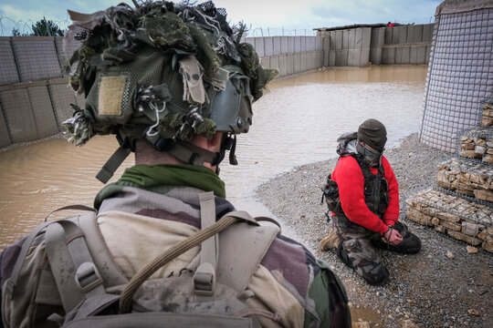 Dealing with the local population, part of the scenario of a joint French and American paratrooper exercise, Castres, France