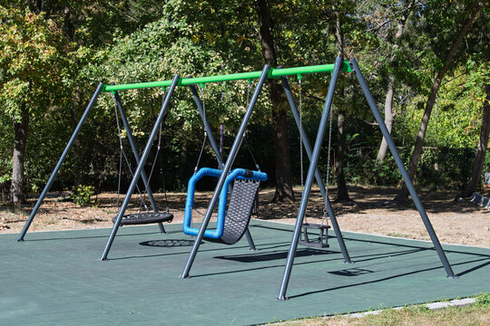 Empty swing set with adaptive inclusive playground seat