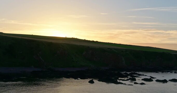 Sunset over rugged coastline of Eyemouth 1