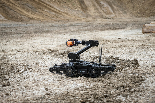 Bomb disposal robot moving onto the ground during a dynamic demonstration at a defence trade fair in Paris, France