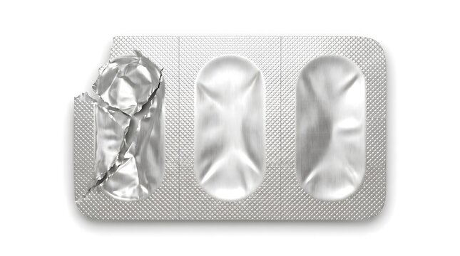 Used silver foil pill blister pack with open torn compartment isolated on white background, top view