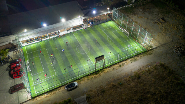 Aerial View of Illuminated Soccer Field at Night