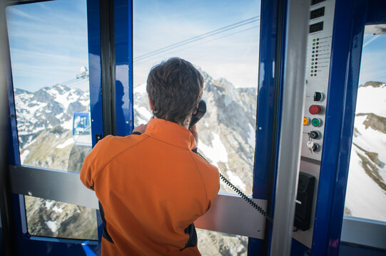 Riding the cable car up the last section with the mountain range coming into view, Pic du Midi de Bigorre, French Pyrenees, France