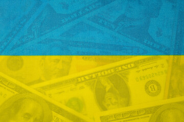 Fototapeta premium Ukrainian Flag Colors Over Dollar Banknotes