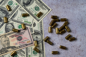 Fototapeta premium Money and Bullet Casings Symbolizing War Financing