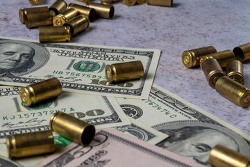 Fototapeta premium Money and Bullet Casings Symbolizing War Financing