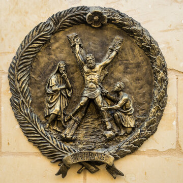 Bronze Relief of Saint Andrew on Saltire Cross Plaque in Patras, Greece