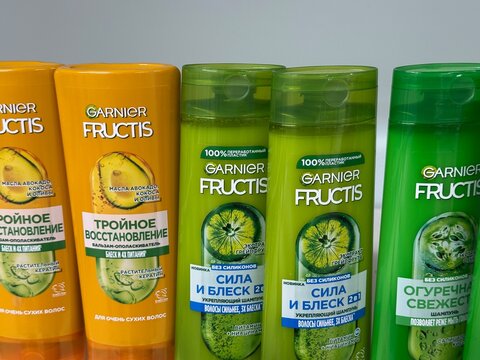 Garnier Fructis hair care products including shampoo and conditioner bottles on display