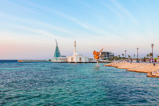 Al Rahmah Mosque, also known as the Floating Mosque, stands elegantly on the turquoise waters of the Red Sea, connecting with the modern Jeddah Waterfront Corniche in Saudi Arabia