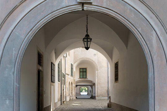 Arched Passageway Through a Historic Courtyard