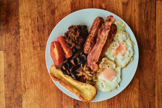 Full English Breakfast Plate With Eggs and Bacon From Above