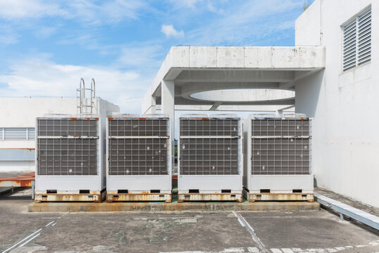 Row of Commercial Air Conditioner Outdoor Units on Building Rooftop