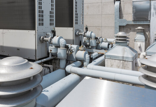 Rooftop Water Pipes and Ventilators for Commercial Building HVAC