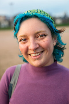 Smiling woman with dyed hair