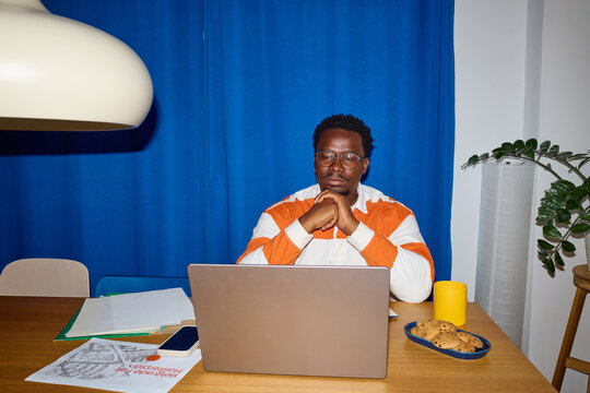 Man stares at his laptop