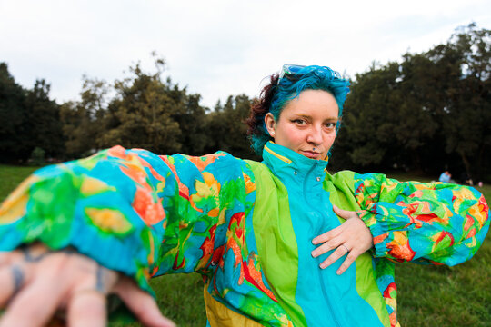 Woman in colorful jacket posing