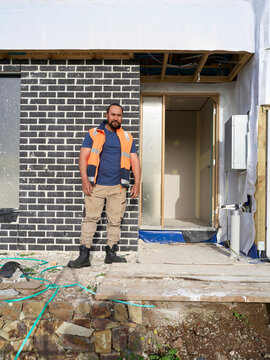 Maori Construction Worker Poses Near Building Site