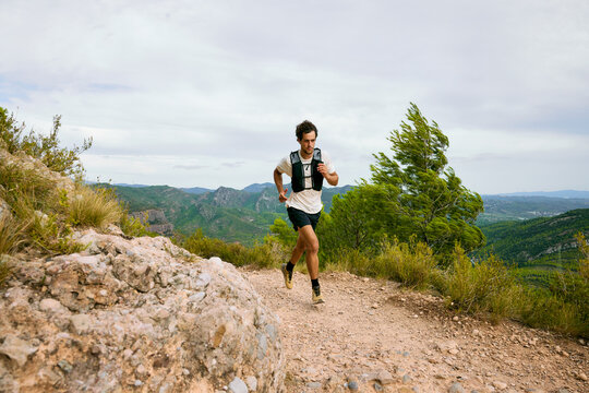 Trail Runner On Mountain Path